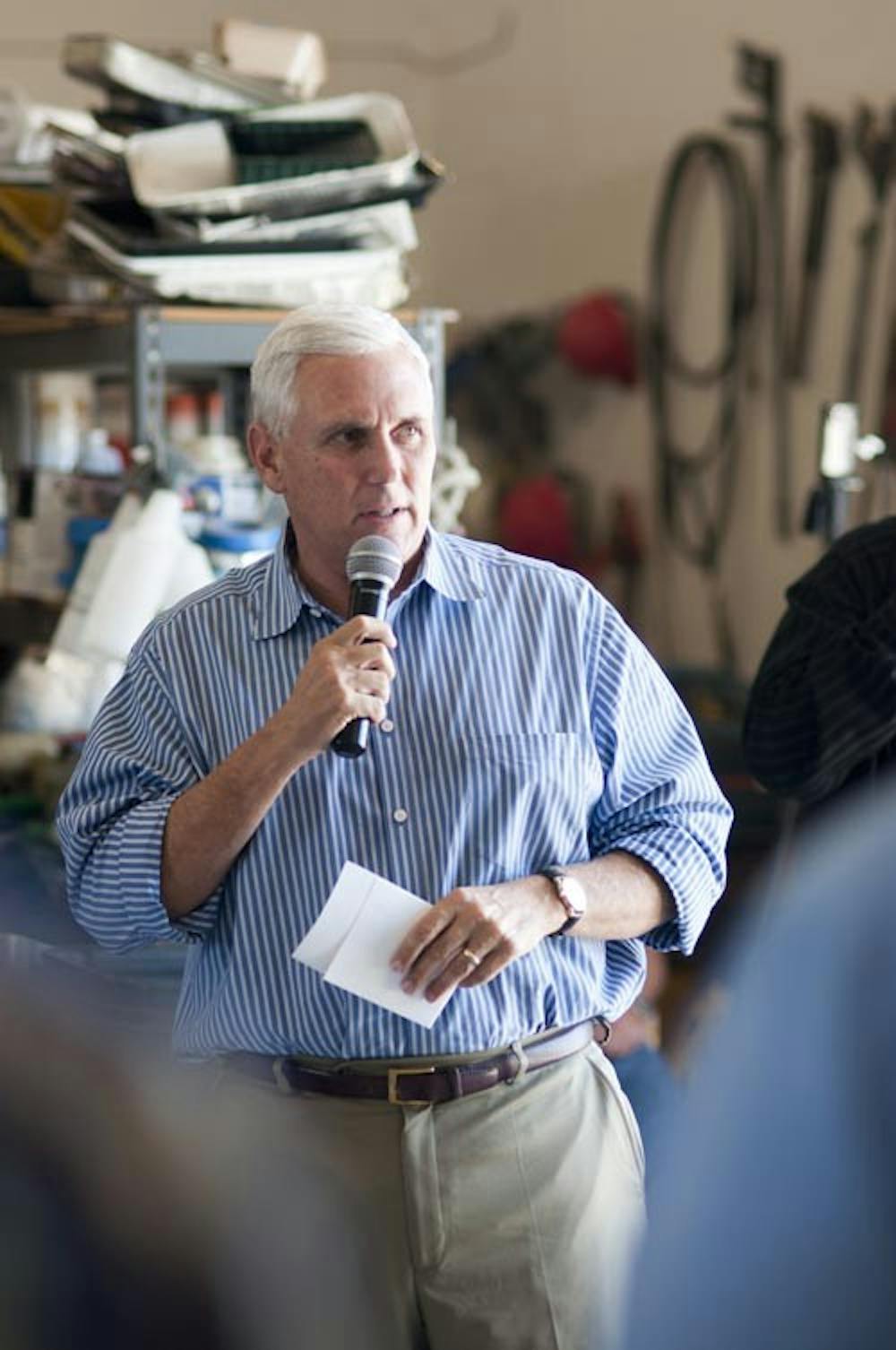 Then-Rep. Mike Pence talks to constituents about his endorsement of Brad Olivers on Oct. 4, 2012 at S.A. Boyce Corp. Pence’s inauguration today officially starts his term as governor of Indiana. DN FILE PHOTO JONATHAN MIKSANEK