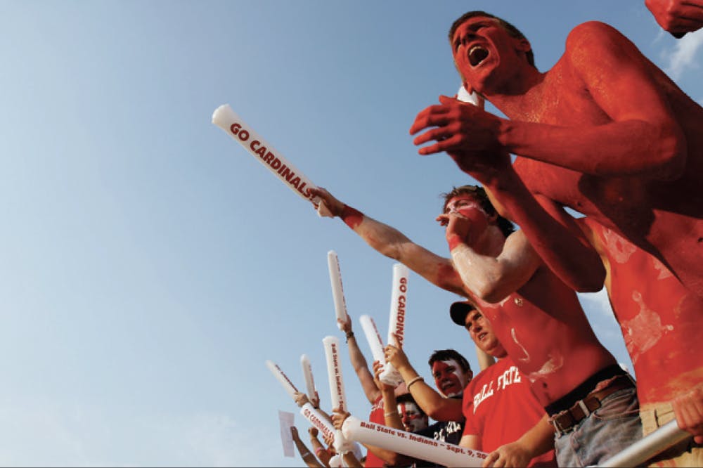 <p>Kyle Ellis and Colin Moore cheer during the announcements of the starting lineup for the Cardinals before the start of the game against Indiana at Scheumann Stadium on Sep. 9, 2006. <strong>Will Vragovic, DMR</strong></p>