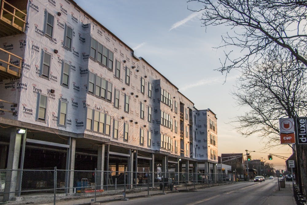 Construction on the Village Promenade is underway in The Village. The apartment is on track for completion by its Aug. 16 move-in date. DN PHOTO JONATHAN MIKSANEK