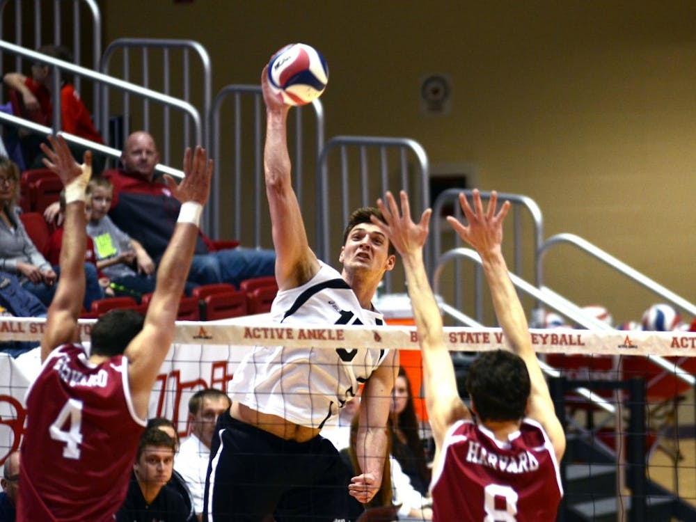 Marcin Niemczewski, a senior outside attacker, attempts to hit the ball over the net during the match against Harvard on Jan. 15 at Worthen Arena. DN PHOTO EMMA ROGERS