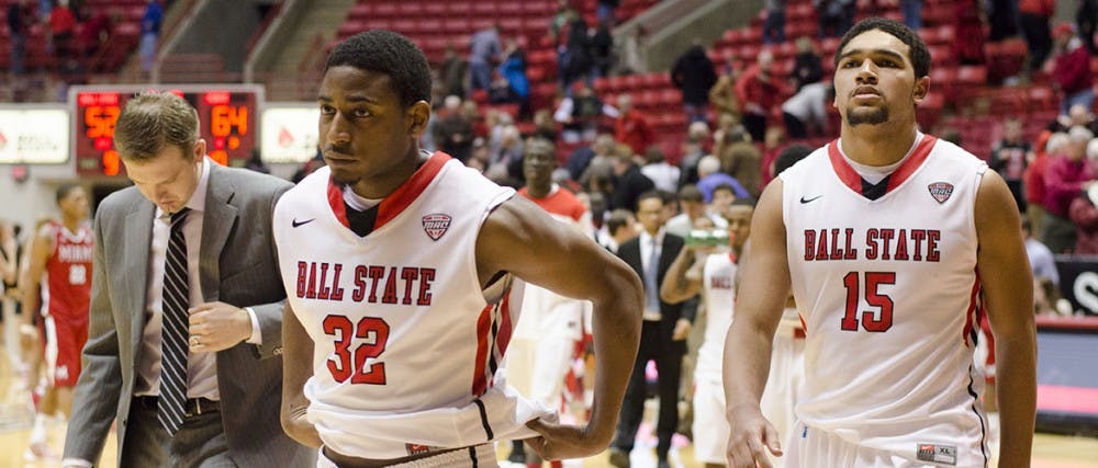 Senior guard Jesse Berry and freshman forward Franko House walk off the court at the end of the game against Miami Jan. 18 at Worthen Arena. Ball State lost 52-64. DN PHOTO BREANNA DAUGHERTY