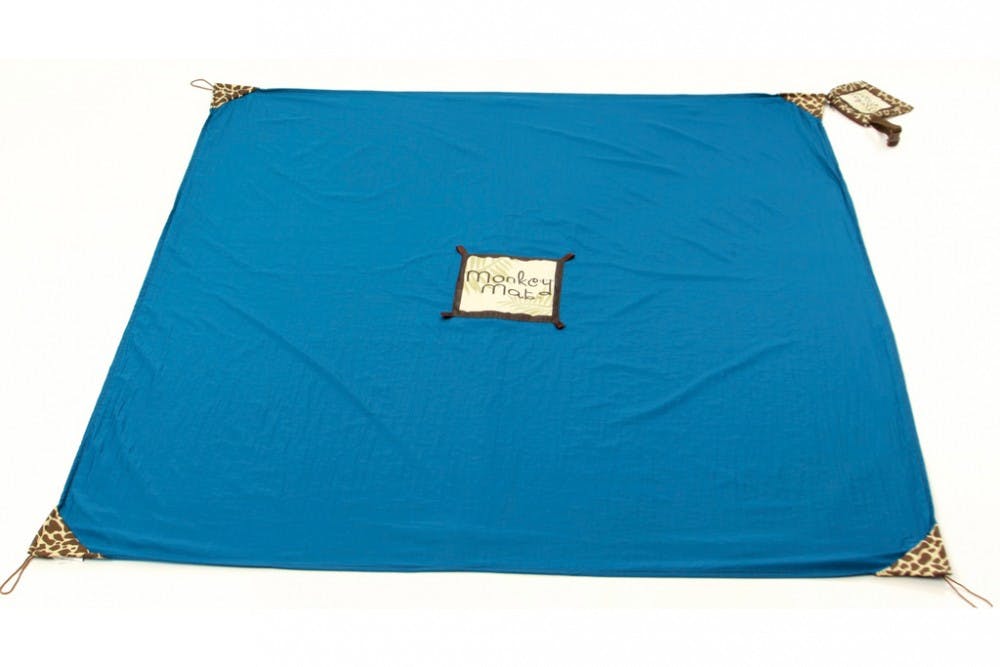 	Alumna Courtney Turich and Christie Barany, her business partner, created the Monkey Mat. It is a compact blanket used as a portable sitting surface at places like airports, soccer games and outdoor activities. PHOTO COURTESY OF MONKEY MAT