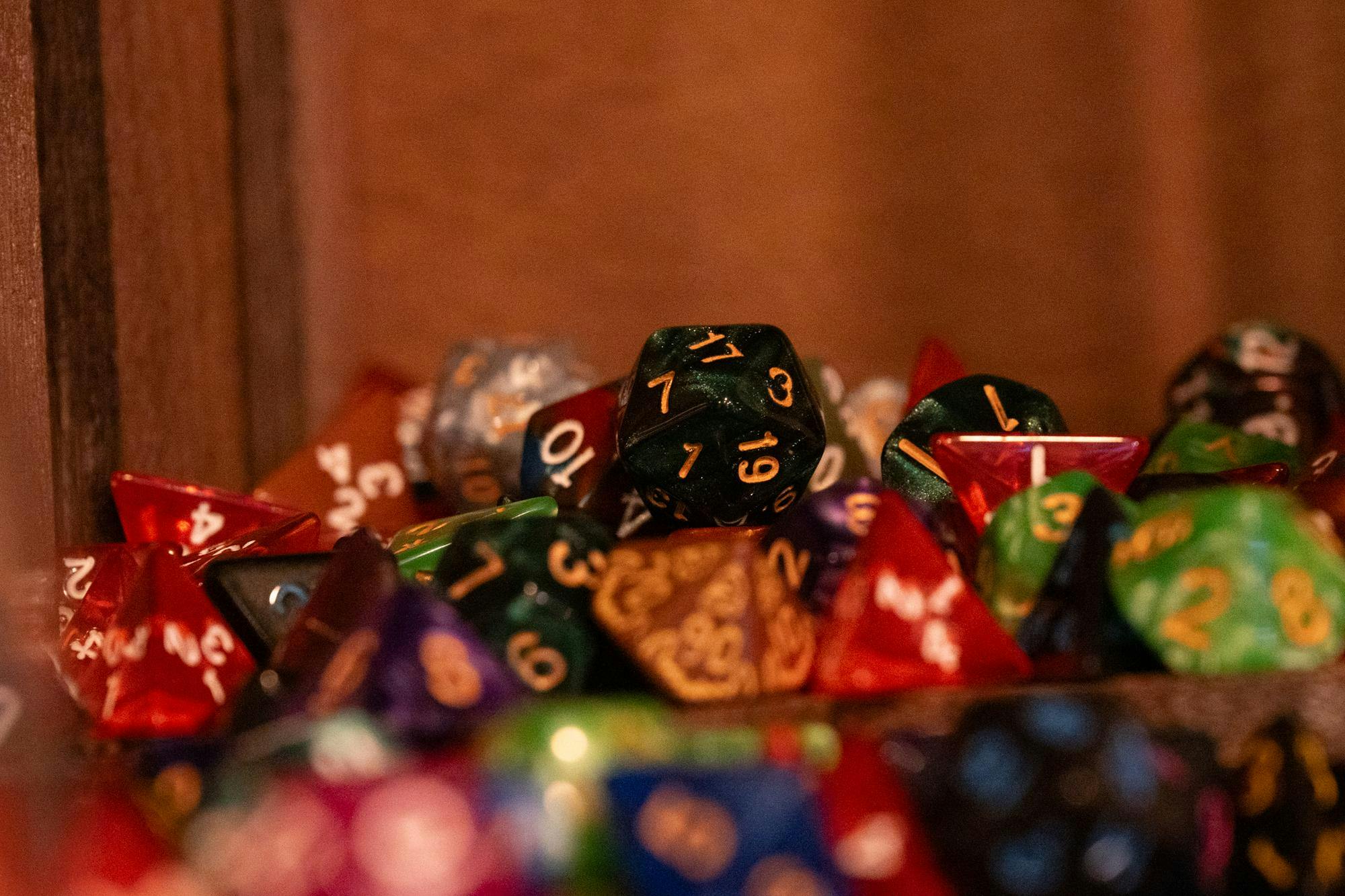 Piles of dice scattered on a shelf in the D20 Dungeon pictured March 20 in Muncie, Indiana. Ryan Fleek, DN