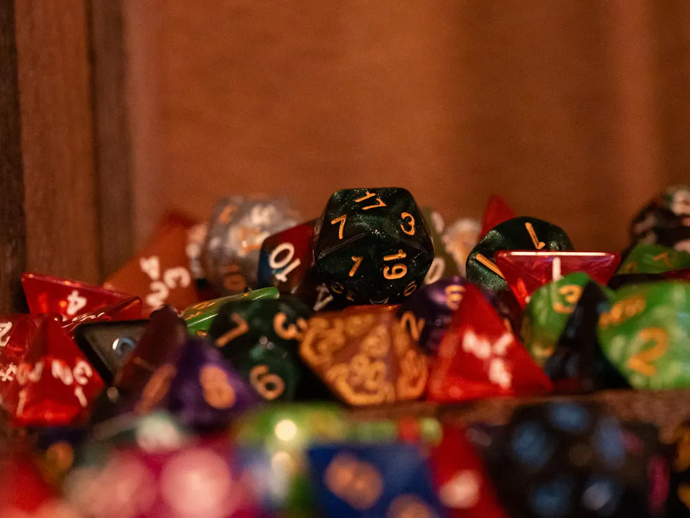 Piles of dice scattered on a shelf in the D20 Dungeon pictured March 20 in Muncie, Indiana. Ryan Fleek, DN