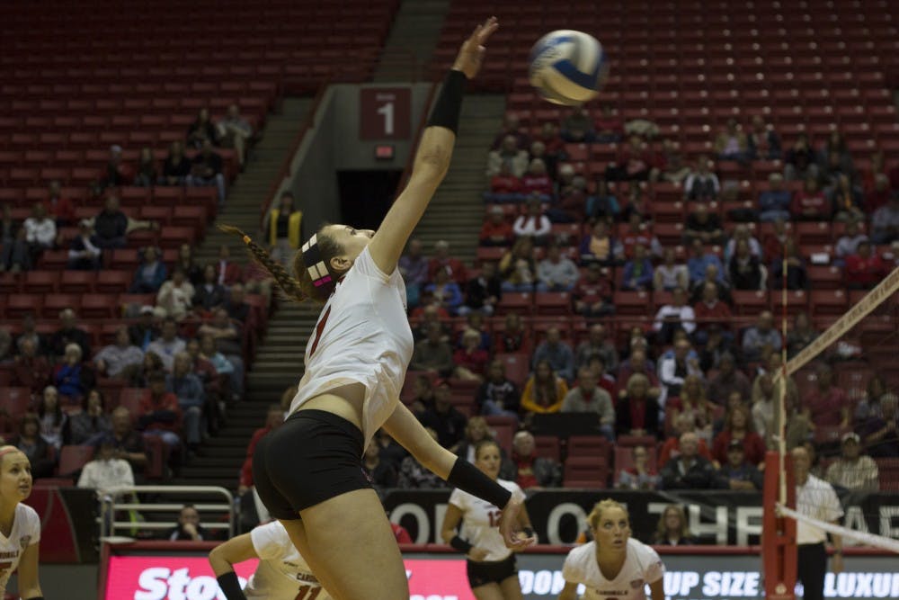Lauren Grant, a senior opposite hitter, spikes the ball during the match against Eastern Michigan on Nov. 2. Ball State won the match 3-0. DN PHOTO EMMA ROGERS