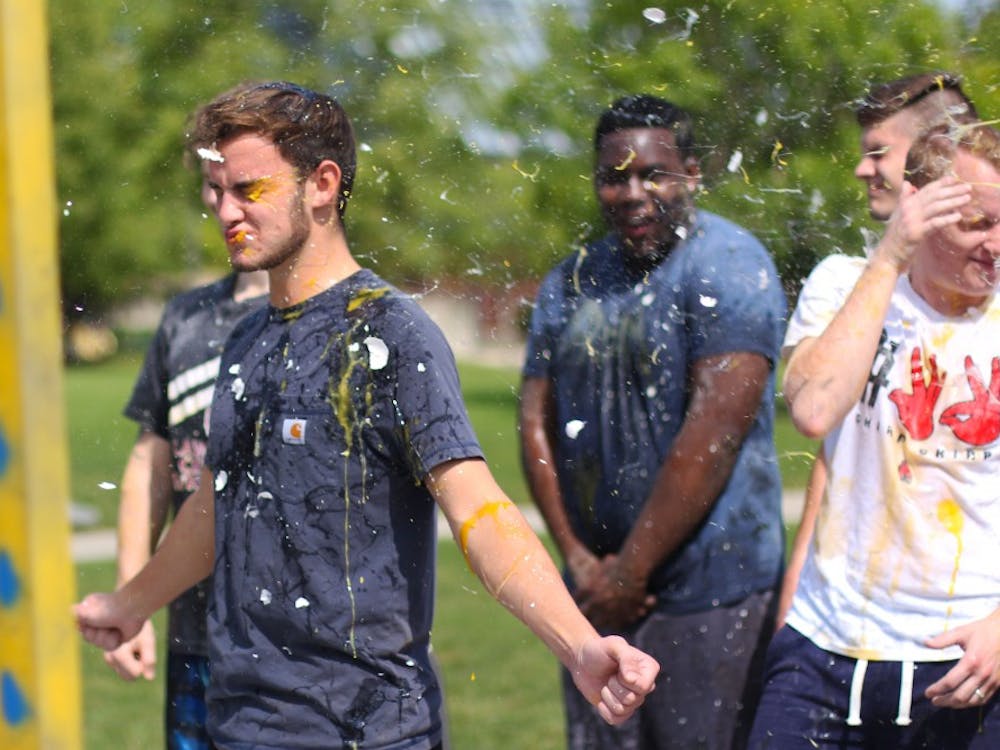 Eggs are thrown at members of Alpha Tau Omega Thursday, Sept. 13, 2018, on University Green. Proceeds of the fundraiser went to Mental Health America. Demi Lawrence, DN