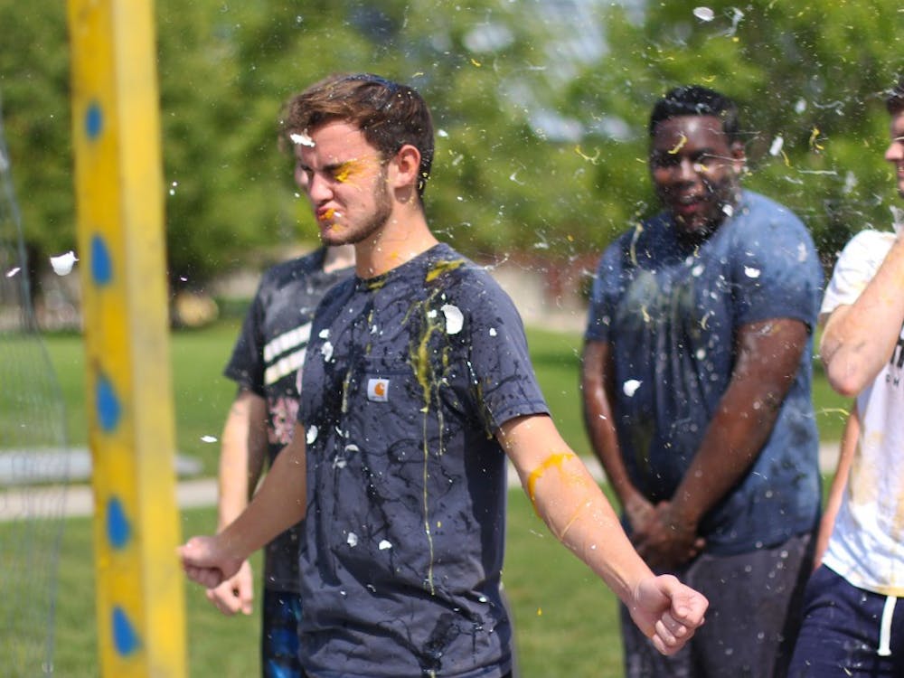 Eggs are thrown at members of Alpha Tau Omega Thursday, Sept. 13, 2018, on University Green. Proceeds of the fundraiser went to Mental Health America. Demi Lawrence, DN