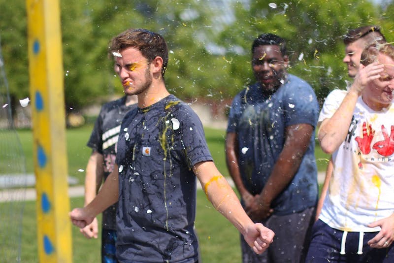 Eggs are thrown at members of Alpha Tau Omega Thursday, Sept. 13, 2018, on University Green. Proceeds of the fundraiser went to Mental Health America. Demi Lawrence, DN