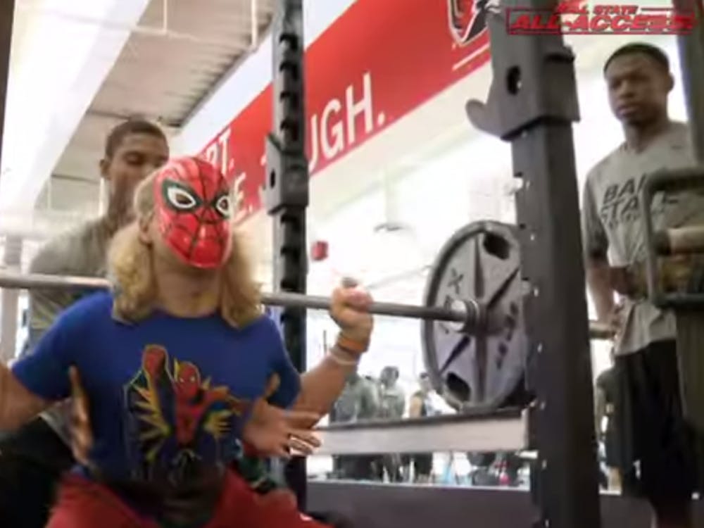 Ball State football players dressed up as superheroes for max-out leg day. The players walked through a tunnel of smoke and lights to show off their costumes. PHOTO COURTESY OF BALL STATE SPORTS YOUTUBE