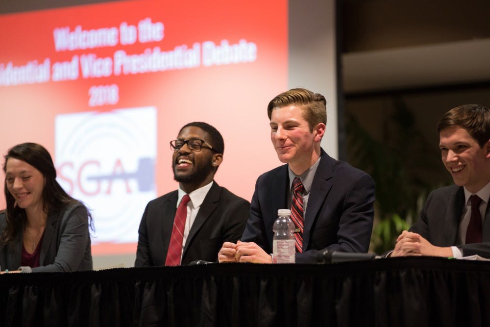 <p>Kyleigh Snavely, secretary, Jalen Jones, treasurer, Matt Hinkleman, vice president, and Isacca Mitchell, president of Amplify during the 2018 All Slate debate hosted by the Student Government Association at L.A. Pittenger Student Center on Feb 18. <strong>Eric Pritchett, DN</strong></p>