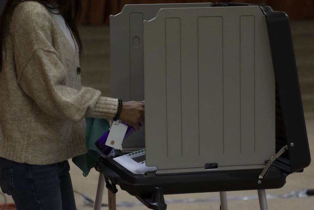 <p>A poll worker cleans off a voting machine Nov. 3, 2020, at First Presbyterian Church. Delaware county had 98 polling locations for voters. <strong>Jacob Musselman, DN</strong></p>