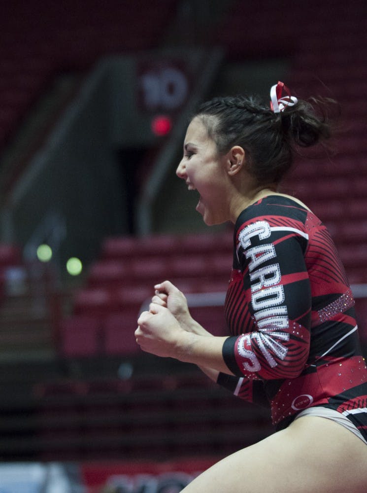 Sophomore Sydney Finke celebrates after completing her floor routine during the meet against Northern Illinois University on Jan. 15 in Worthen Arena. Emma Rogers // DN