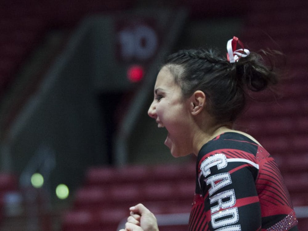 Sophomore Sydney Finke celebrates after completing her floor routine during the meet against Northern Illinois University on Jan. 15 in Worthen Arena. Emma Rogers // DN