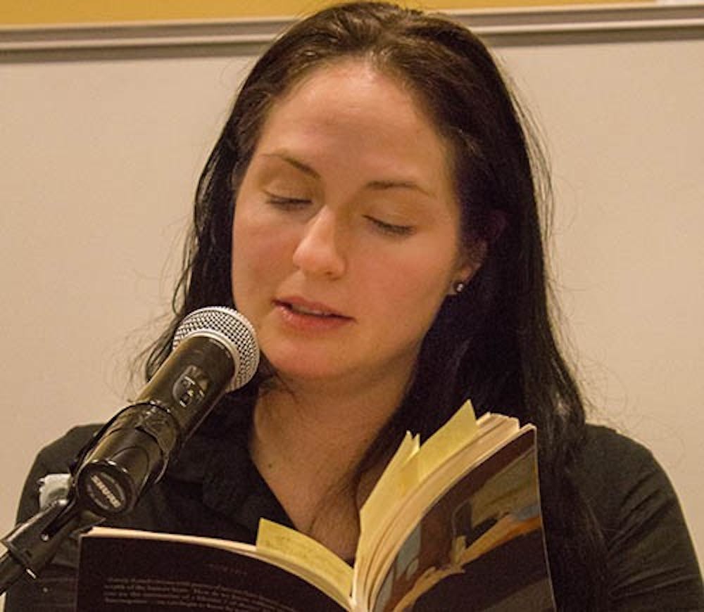 Danielle Cadena Deulen reads a poem from her book entitled Lovely Asunder. Deulen spoke as a part of the English Department's Visiting Writer Series on Feb. 13 in Letterman Building 125. DN PHOTO TAYLOR IRBY