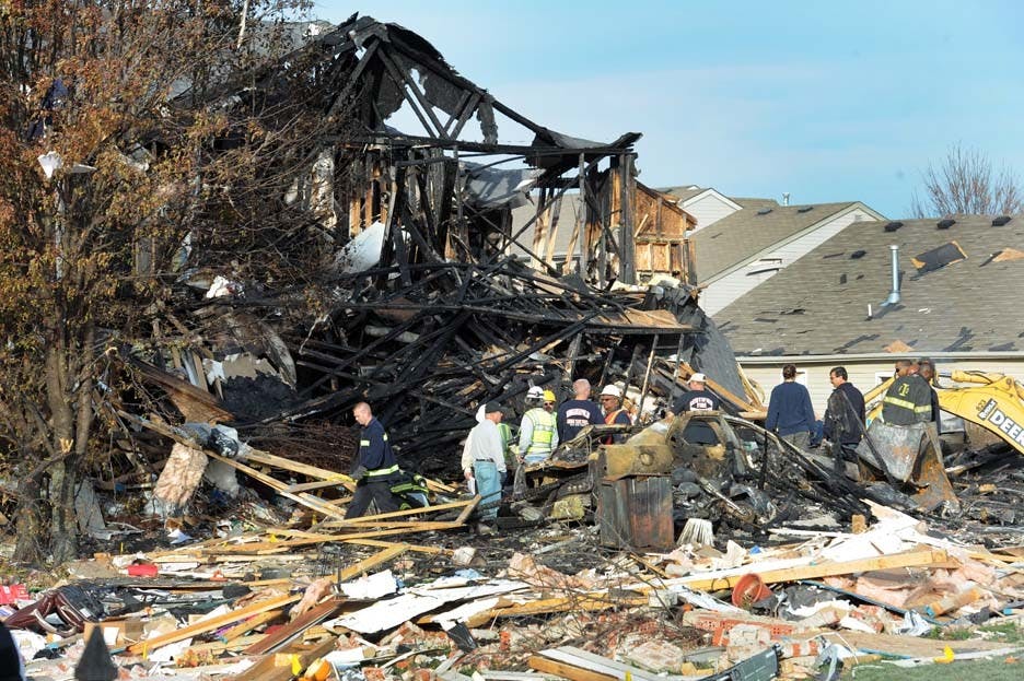 Numerous emergency scene investigators along with members of Citizens Energy Group continue to survey the destroyed homes along Fieldfare Way on the south side of Indianapolis after Saturday’s explosion. The cause of the explosion is still undetermined. PHOTO PROVIDED BY MATT KRYGER AND THE INDIANAPOLIS STAR