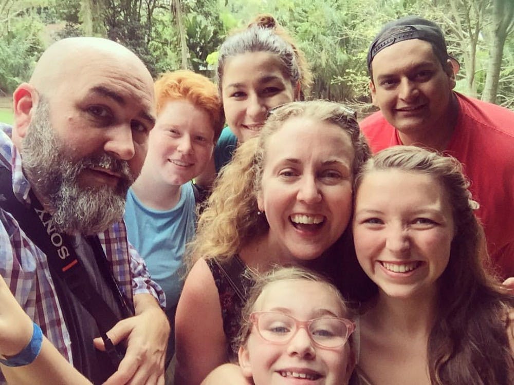 Ball State instructor Colleen Steffen poses with her daughter Tommy, husband&nbsp;Ryan Sparrow and a few of her students while on the BSU at the Games trip in Rio de&nbsp;Janeiro.&nbsp;Steffen worked at four newspapers in three different states and has done a long list of jobs, including a telephone operator, a janitor and a daycare employee, before teaching at Ball State. Colleen Steffen Facebook // Photo Courtesy
