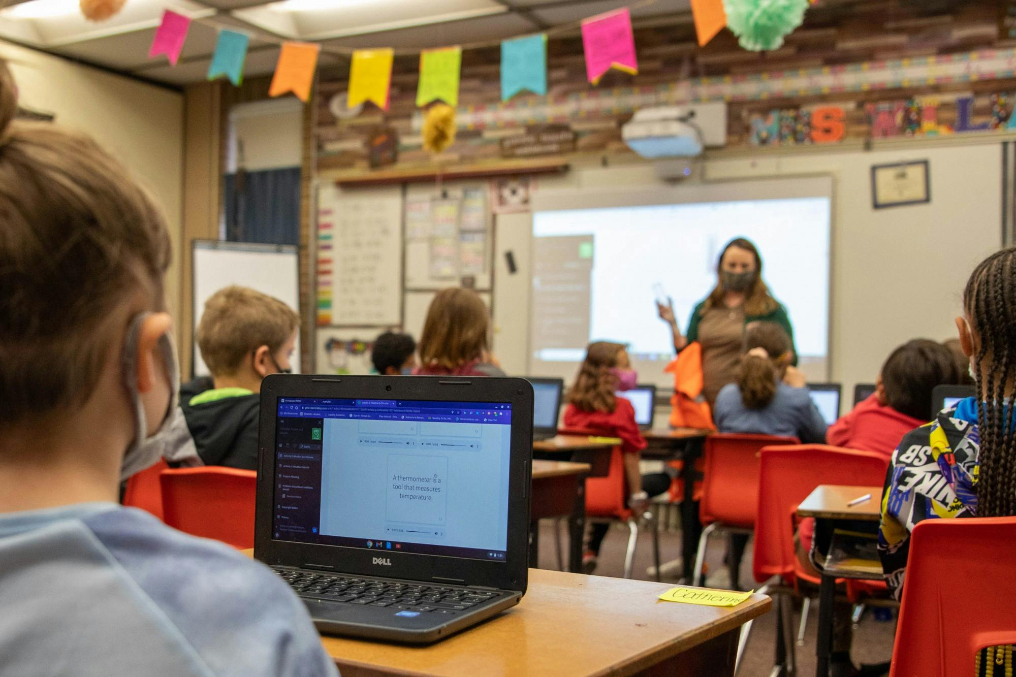 Catherine, a third-grade student at East Washington Academy, uses her laptop to learn about thermometers during her class April 19, 2021. The High Ability Program teaches an advanced curriculum to gifted learners in a separate classroom from the general education population for the whole school day. Jaden Whiteman, DN