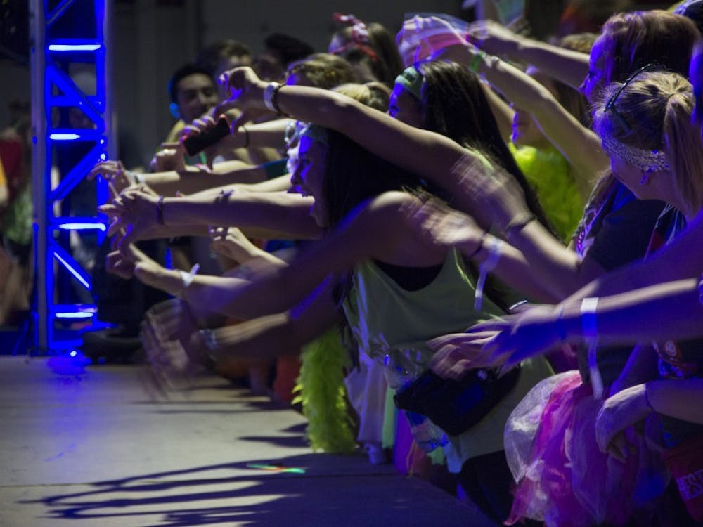 Dance Marathon participants dance near the stage during the last two hours of the event. DN PHOTO EMMA ROGERS
