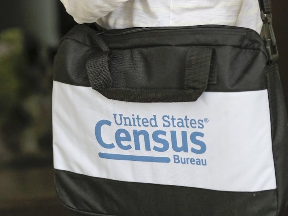 A briefcase of a census taker is seen as she knocks on the door of a residence Tuesday, Aug. 11, 2020, in Winter Park, Fla. A half-million census takers head out en mass this week to knock on the doors of households that haven't yet responded to the 2020 census. (AP Photo/John Raoux)