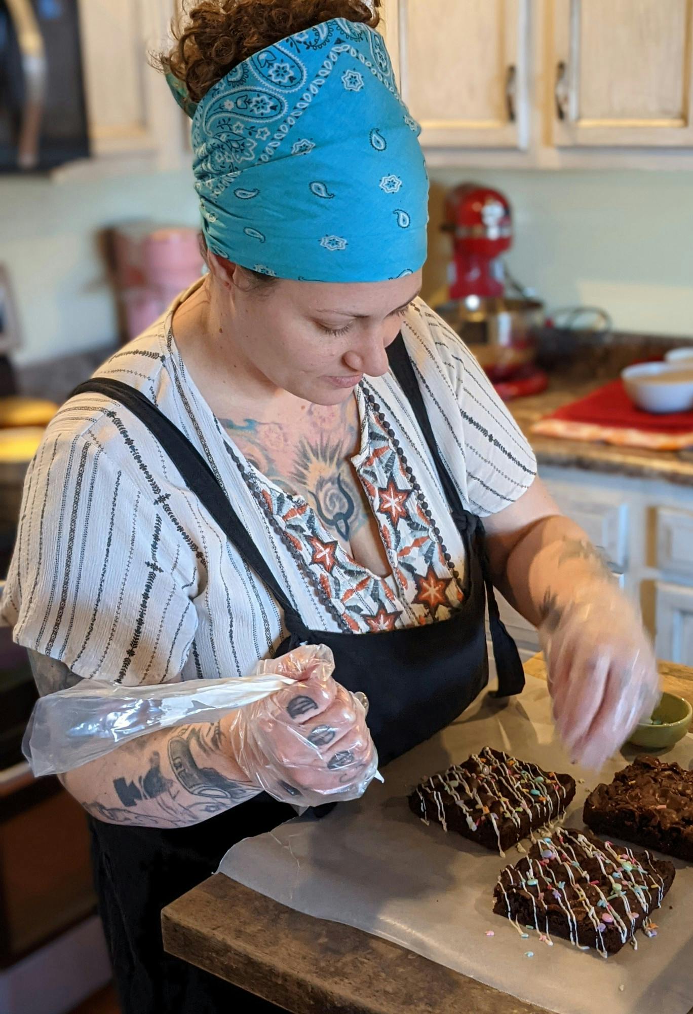 Chelsea McDonnel pipes icing onto brownies from Muncie Macs and More’s spring menu. In addition to brownies, lemon and strawberry treats are also popular during the spring. Chelsea McDonnel, Photo Provided