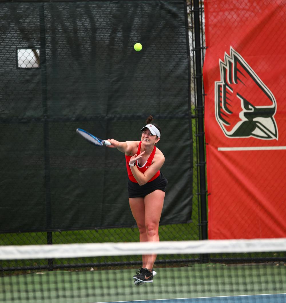 Graduate student Allison Mulville serves the ball in a match against Bowling Green. April 14 at the Cardinal Creek Tennis Center. Jacy Bradley, DN