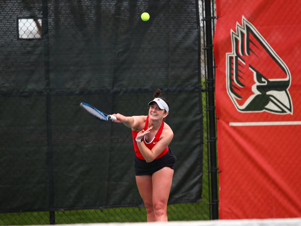 Graduate student Allison Mulville serves the ball in a match against Bowling Green. April 14 at the Cardinal Creek Tennis Center. Jacy Bradley, DN