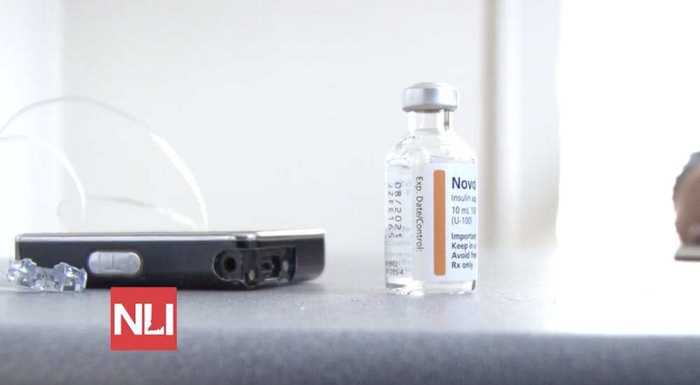 An insulin vial and pump sit on the desk of Brandon Clidence at his Ball State office Nov. 12. Clidence has required insulin for around 20 years after being diagnosed with Type 1 Diabetes at age 26.