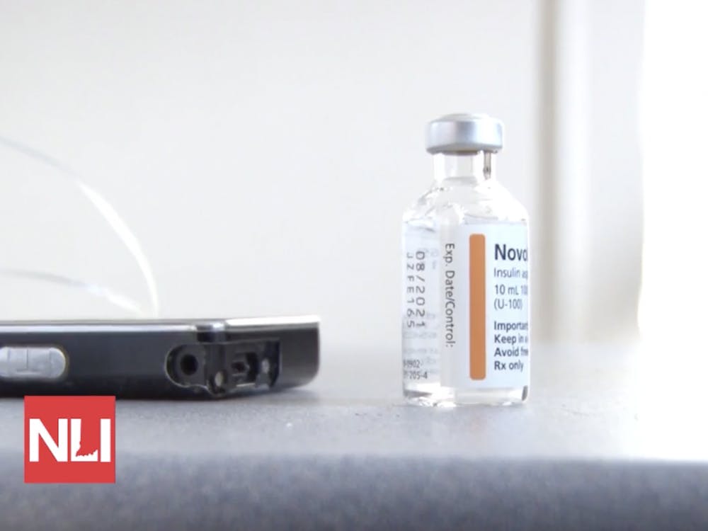 An insulin vial and pump sit on the desk of Brandon Clidence at his Ball State office Nov. 12. Clidence has required insulin for around 20 years after being diagnosed with Type 1 Diabetes at age 26.
