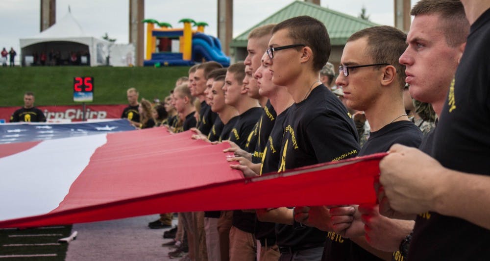 <p>Members of Ball State's Army ROTC program present the flag on the field of Scheumann Stadium before the game against Northern Illinois on Oct. 1. Ball State Reserve Officer Training Corp gives students the opportunity to become a commissioned officer in the military upon graduation from college. Grace Ramey, DN File</p>