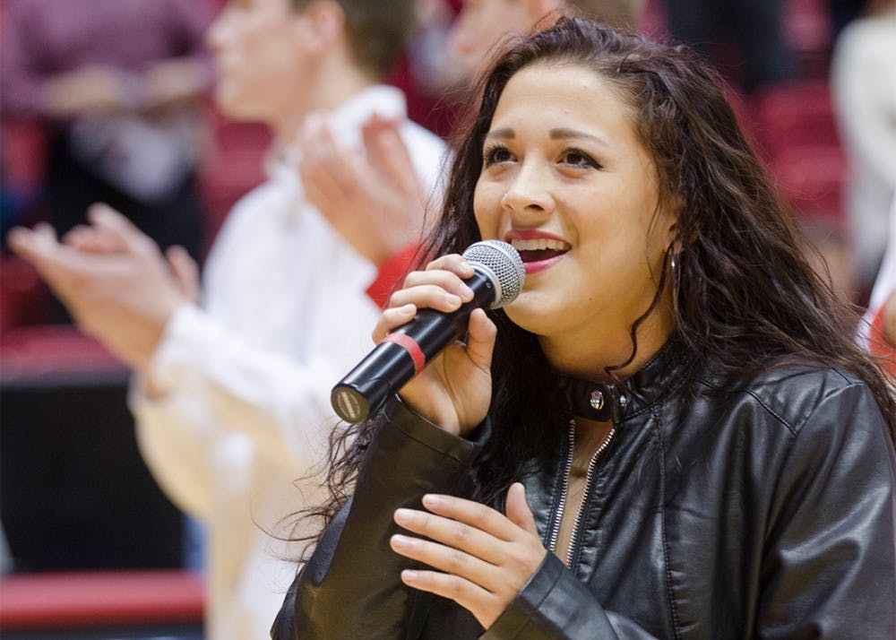 <p>Sophomore Lauren Hall sings the Star-Spangled Banner before the men's basketball game November 2014 at Worthen Arena. After Ball State, Hall moved out west to California to pursue her passion for music. <strong>Breanna Daugherty, DN File&nbsp;</strong></p>