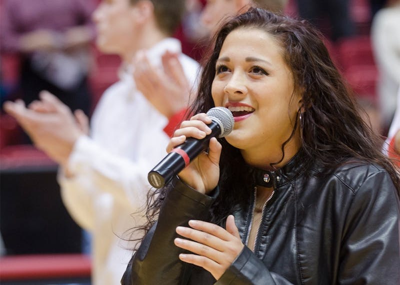 Sophomore Lauren Hall sings the Star-Spangled Banner before the men's basketball game November 2014 at Worthen Arena. After Ball State, Hall moved out west to California to pursue her passion for music. Breanna Daugherty, DN File&nbsp;