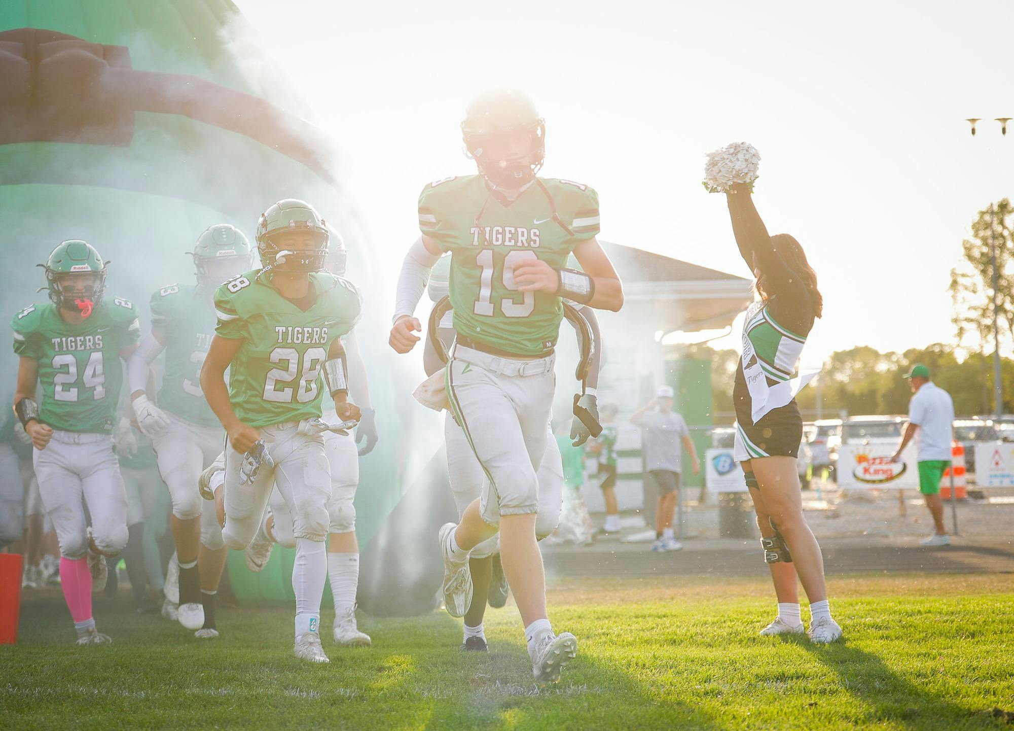 The Yorktown Tigers run out to play Delta High School Sept. 13 at Yorktown High School. Andrew Berger, DN 