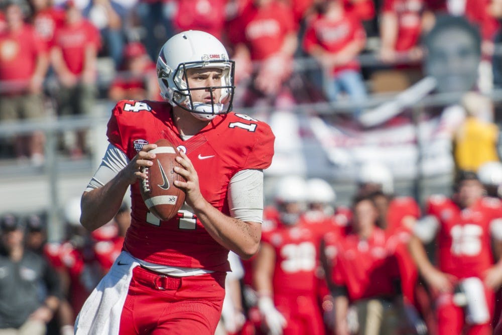 Freshman quarterback Jack Milas looks for coverage downfield during the game against Akron on Oct. 25 at Scheumann Stadium. DN PHOTO JONATHAN MIKSANEK