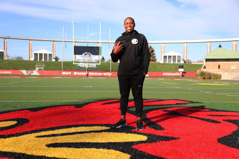 Assistant head coach Tyler Stockton poses for a photo Nov. 3 at Scheumann Stadium. Stockton was named assistant head coach in the summer of 2022. Mya Cataline, DN