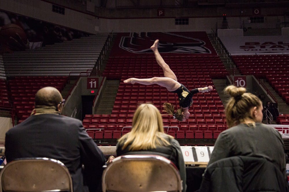 <p>A member of the Wester Michigan Broncos goes through her beam routine in John E. Worthen Arena Feb. 3, 2019, during the gymnastics meet against the Ball State University Cardinals. With a team score of 48.125 the Cardinals won over the Broncos in the beam portion of the meet. <strong>Eric Pritchett,DN</strong></p>