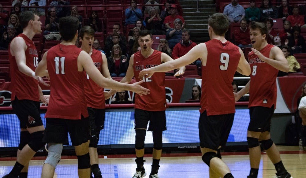 The Cardinals come together after winning a volley against the Lions during the second game on March 30 at John E. Worthen Arena. Ball State won 3 of the 5 games against Lindenwood. Rebecca Slezak, DN