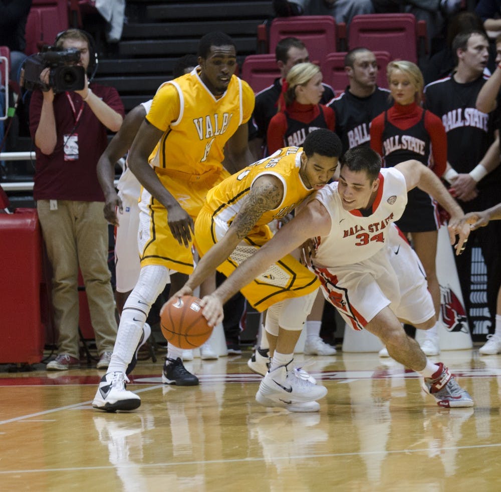 Senior forward Tyler Koch tries to steal the ball away from a Valparaiso player during the game on Dec. 4 at Worthen Arena. DN PHOTO BREANNA DAUGHERTY
