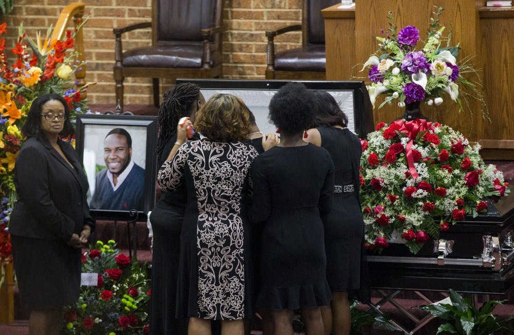 Mourners comfort Allison Jean, Botham Jean's mother, during the public viewing before the funeral of Botham Shem Jean at the Greenville Avenue Church of Christ on Thursday, Sept. 13, 2018, in Richardson, Texas. He was shot and killed by a police officer in his Dallas apartment. TNS Photo