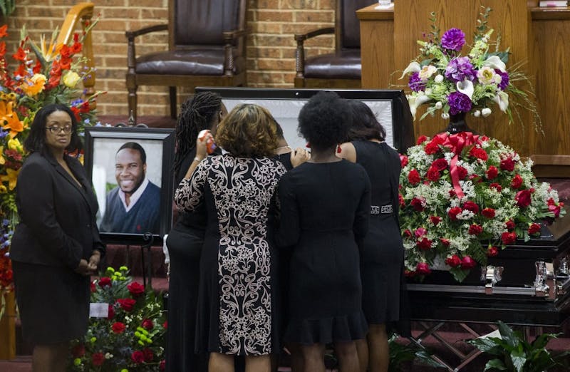 Mourners comfort Allison Jean, Botham Jean's mother, during the public viewing before the funeral of Botham Shem Jean at the Greenville Avenue Church of Christ on Thursday, Sept. 13, 2018, in Richardson, Texas. He was shot and killed by a police officer in his Dallas apartment. TNS Photo