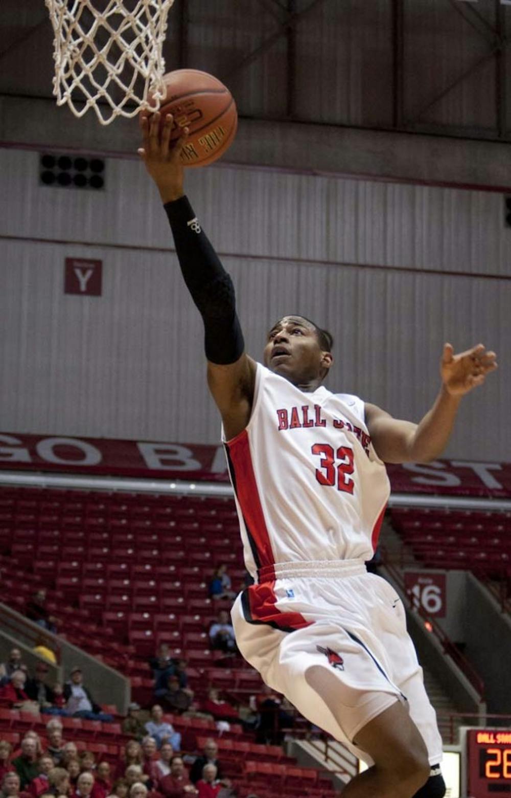 Sophomore Jesse Berry leaps toward the basket for a lay up. Berry was selected as the preseason all MAC for the 2012-2013 season. DN FILE PHOTO DYLAN BUELL