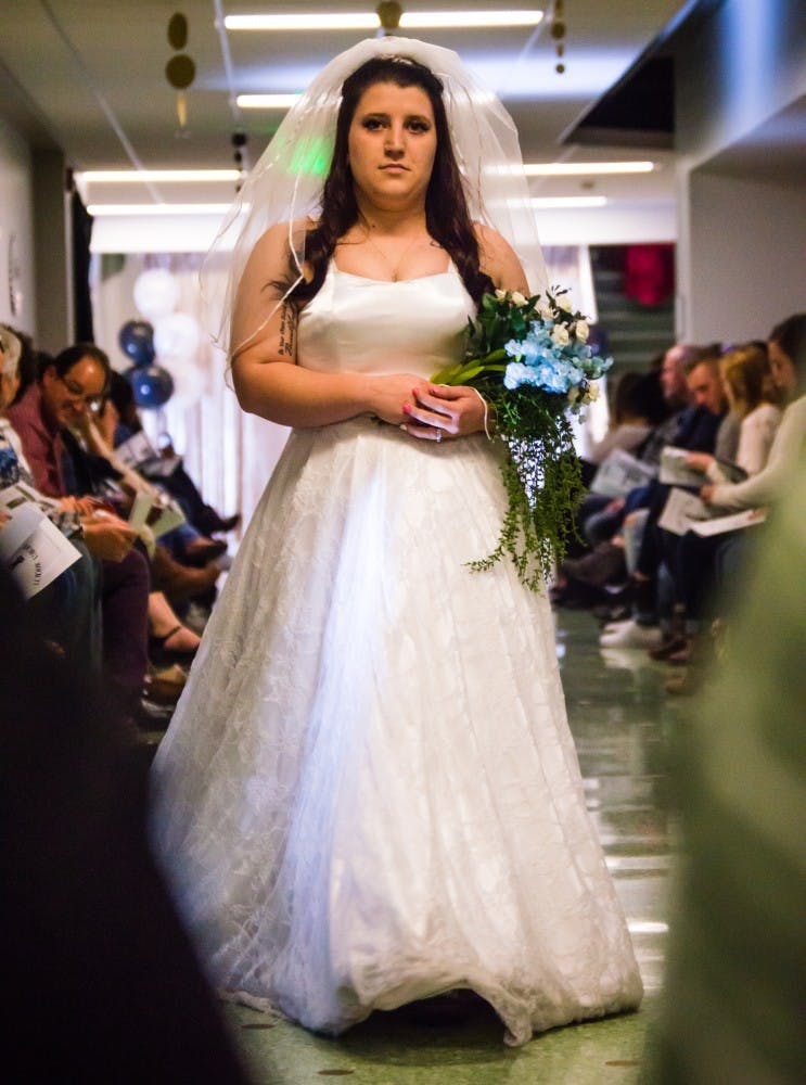 Family and friends watched the Fashion Design Soceity host a fashion show on April 1 in the Applied Technology Building. Since 1997, the organization helps fashion students develop their skills. Teri Lightning Jr., DN