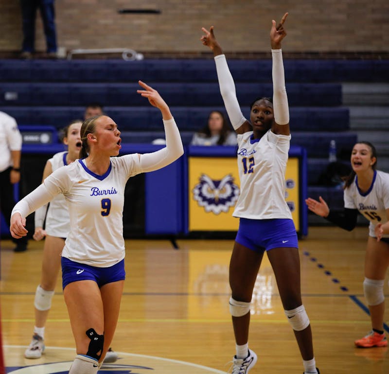 Senior Lilly Howell yells in celebration with her team after spiking the ball against Noblesville High School Sept. 23 at Ball Gymnasium. Andrew Berger, DN 