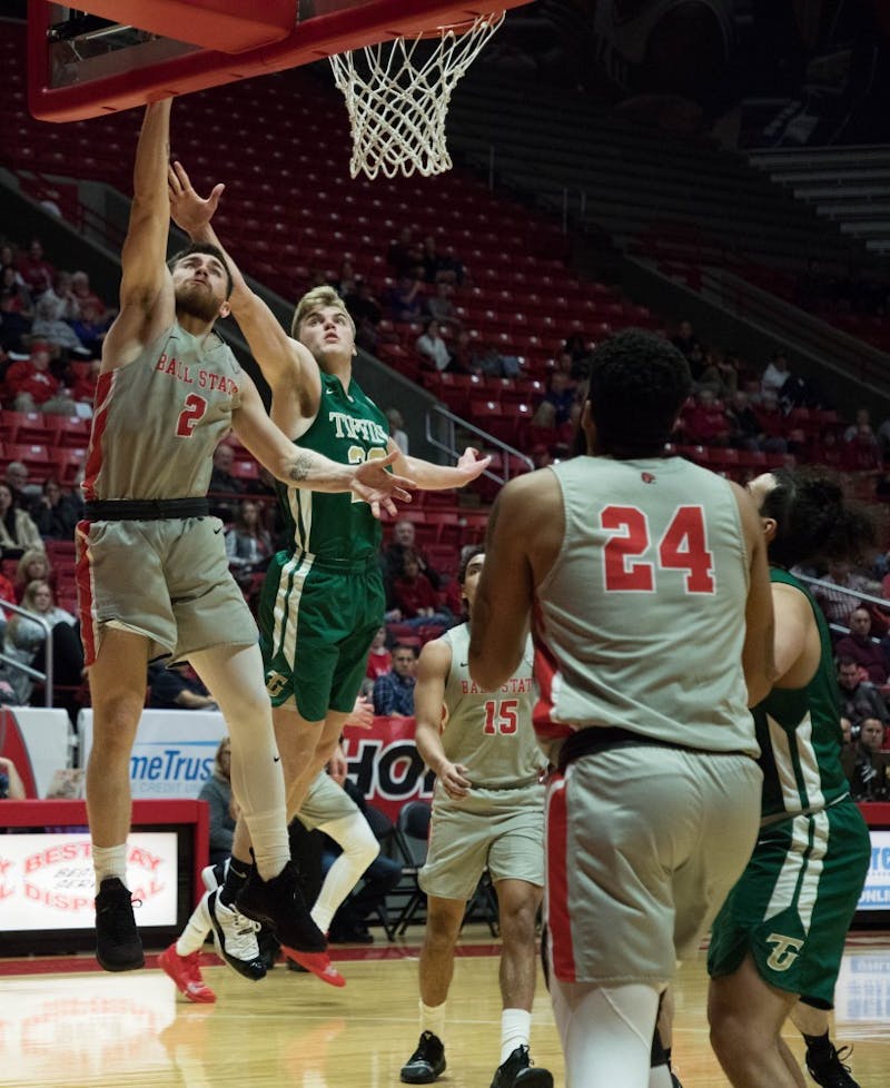 Senior Tayler Persons jumps to score against the Tiffin Dragons at John E. Worthen Arena Nov. 27, 2018. Persons scored 20 points to lead the Cardinals to a 108-62 win. Jack Hart, DN