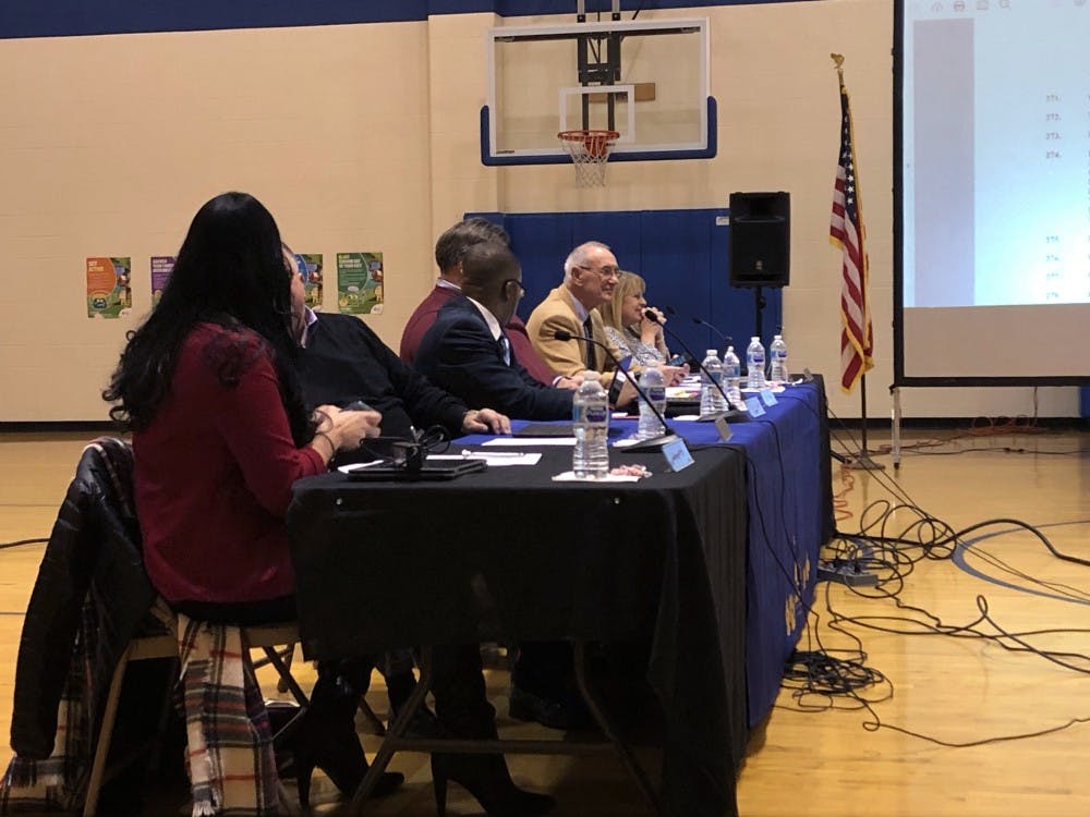 The Muncie Community Schools board sits in the gym at the MCS school board meeting Jan. 22, at Longfellow Elementary School. The board was presented with proposals of a Purdue Polytechnic program located in Madjax for MCS and Ball State students. Sara Barker, DN