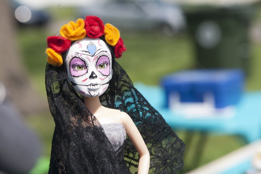 Heekin Park was host to a verity of people selling handmade creations, including this customized doll, on May 17. The doll was one of many crafts available for sale that included decor, toys, clothing and jewelry. DN PHOTO JORDAN HUFFER