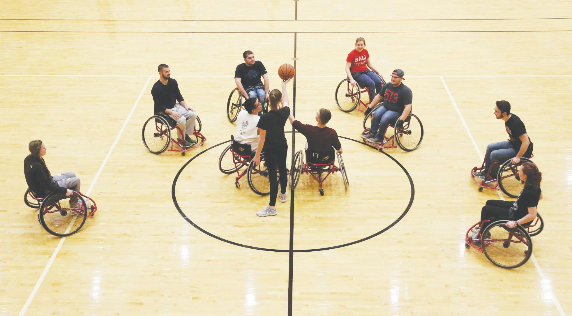 Junior economics major Cheyenne Durbin tips off a basketball in the Jo Ann Gora Student Recreation and Wellness Center Jan. 9, 2019. The Office of Disability Services sponsors a wheelchair basketball tournament each Disability Awareness Month. Ball State University Disability Services, Photo Courtesy