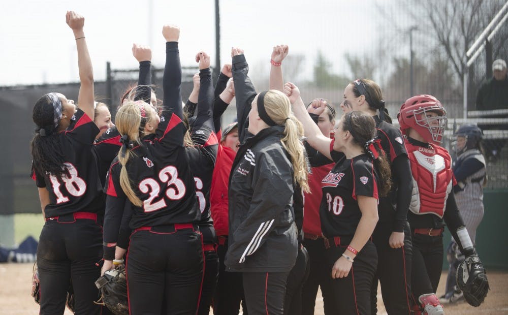 The Ball State softball team cheers in a circle in the game against Toledo on April 6 at the Ball State Softball Complex. DN PHOTO BREANNA DAUGHERTY