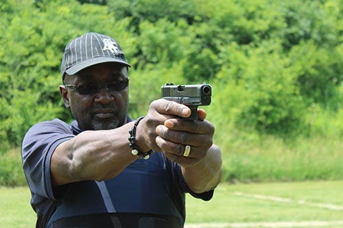 Cpl. Michael Baker demonstrates the proper way to hold a gun. Baker was one of the UPD officers assisting with the gun safety training. The two-day gun safety training course was open to Ball State students and faculty. DN PHOTO KRYSTAL BYERS