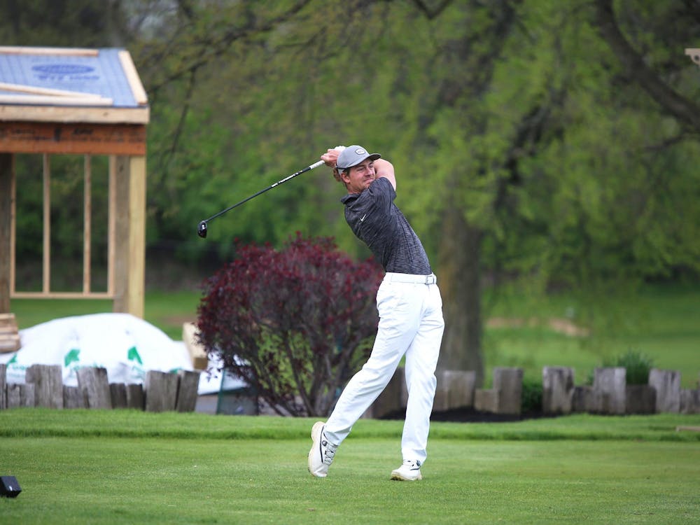 Yorktown senior Christian Groves swings April 27 at the Delaware County Tournament at the Muncie Elks Golf Course. Groves was the individual champion. Zach Carter, DN. 