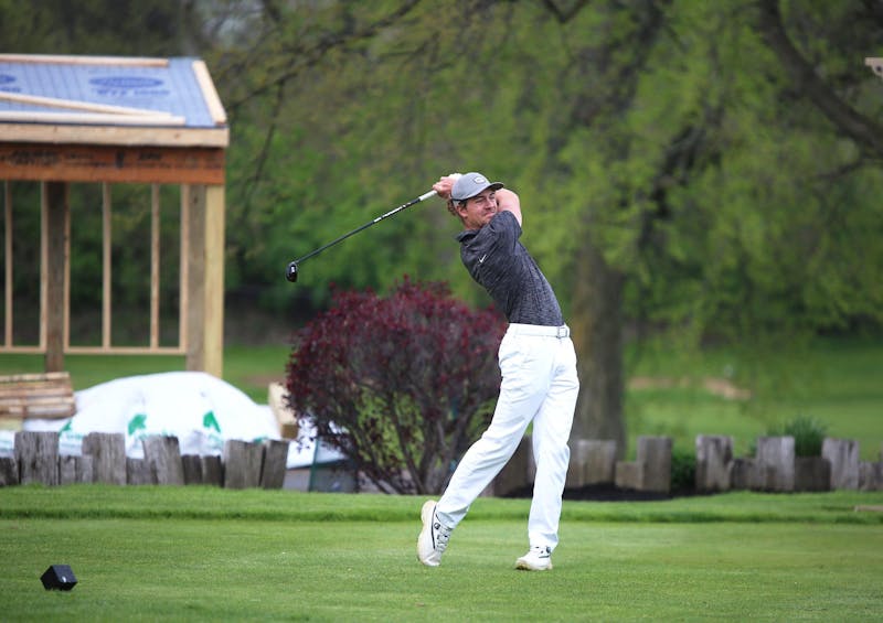 Yorktown senior Christian Groves swings April 27 at the Delaware County Tournament at the Muncie Elks Golf Course. Groves was the individual champion. Zach Carter, DN. 